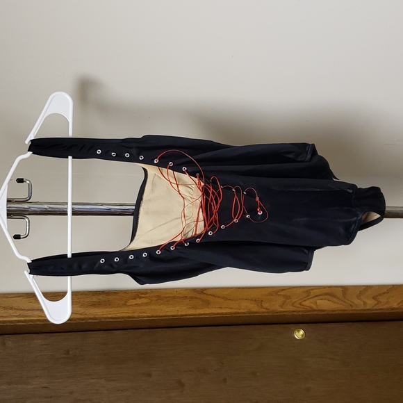 Black swimsuit with red lacing up the back. - Picture 3 of 3